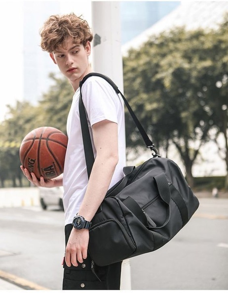 gym duffel bag, sport duffel, travel duffel, weekender bag, sports gym bag, product demo, lifestyle, energetic, trustworthy, neutral, black